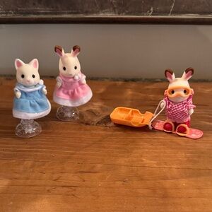 Calico critters 2 ice skaters and a snowboarder